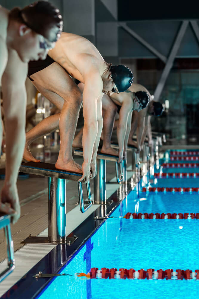 men standing starting blocks